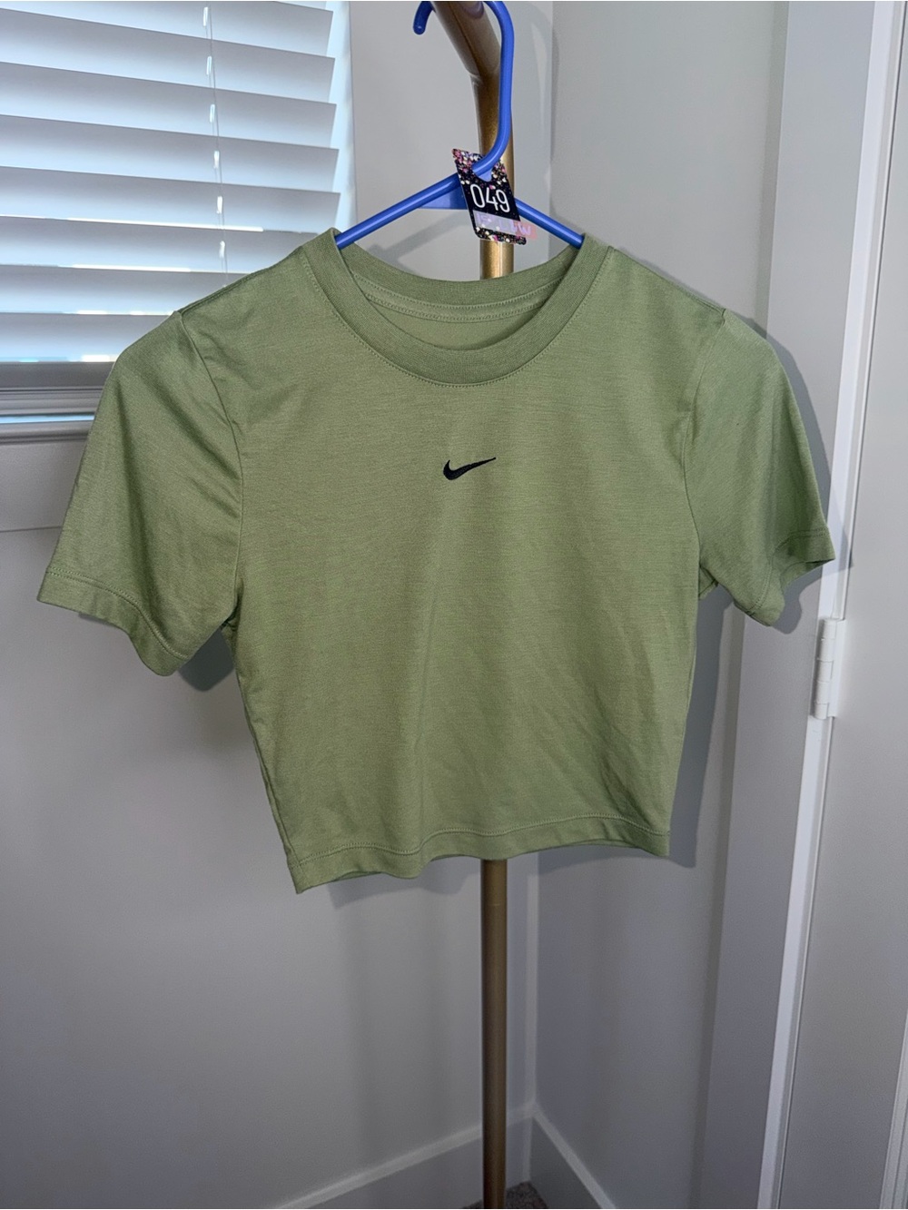 49. Nike Sportswear Essential slim-fit crop t-shirt in Oil Green/Black